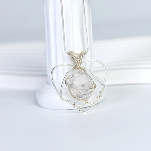 Handmade silver wire wrapped heart necklace with natural raw white crystal pendant