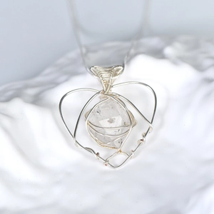 Handmade silver wire-wrapped heart pendant necklace with faceted natural clear crystal