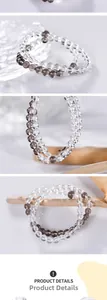Vue détaillée de bracelets en perles de quartz clair et quartz fumé de 6 mm sur verre