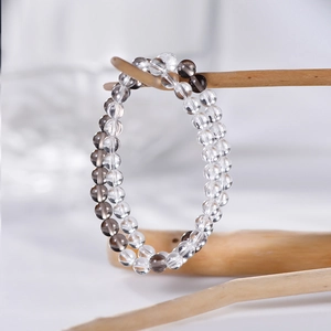 Bracelet double rang en perles de quartz clair et fumé 6mm sur branche bois
