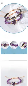 Macro detail of hand-woven amethyst heart bracelet with gold-plated metal edging