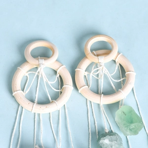 Handmade boho wind chime with natural green raw stones and woven wooden rings