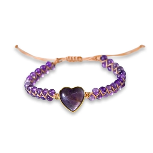 Handmade woven bracelet with heart-shaped purple amethyst stone and adjustable gold cord