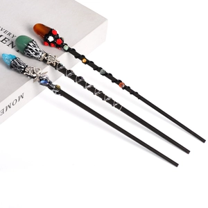 Three mystic wizard wands with natural crystals and life tree metal core ornaments