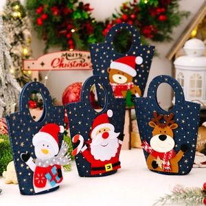 Set of four blue felt Christmas gift bags with stars and festive cartoon characters