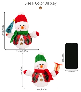 Size display of 21cm plush Christmas snowmen with hats and scarves beside a smartphone