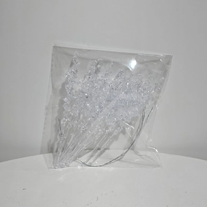 Detailed view of clear acrylic icicle ornaments with pre-drilled holes for festive hanging