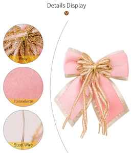 Macro view of pink flannelette Christmas bow with gold glitter edges and steel wire detail