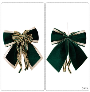 Detailed front and back view of a dark green velvet Christmas bow with gold trim