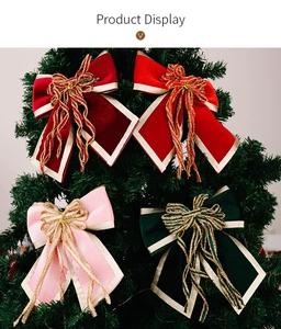 Detail of velvet Christmas bows in red and green colors hanging on a lush festive tree