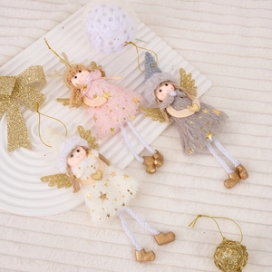 Three plush angel Christmas tree ornaments in pink, grey, and white with gold wings