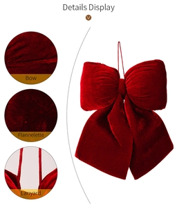 Detail display of festive red velvet bow showing soft flannelette texture and lanyard