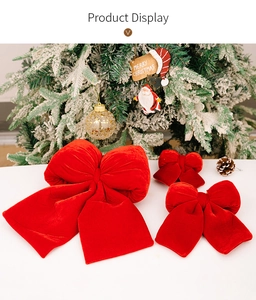 Three sizes of premium red velvet Christmas bows displayed on a white festive tabletop