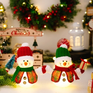 Lighted Christmas snowman plush set with LED decorations for holiday tabletop display