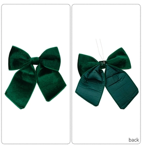 Detailed view of dark green velvet Christmas bow showing front side and back wire fixings