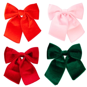 Set of four velvet Christmas bows in red, pink, burgundy, and dark green colors