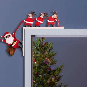 Creative Christmas door frame corner decor featuring Santa and reindeer on white molding