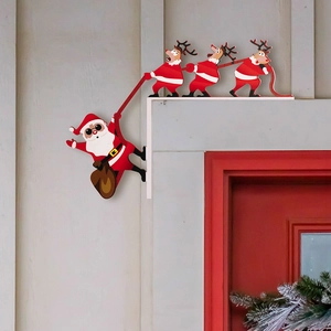Detail of Santa and reindeer door frame decor placed on a white wall corner