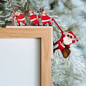Creative Christmas door frame corner decor featuring Santa and reindeer on a wooden frame