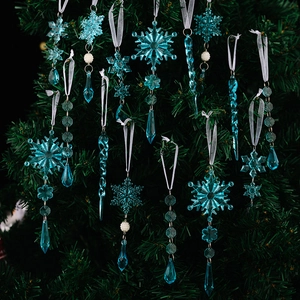 Macro shot of teal acrylic crystal snowflakes and icicles on a Christmas tree
