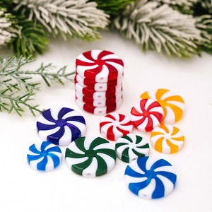 Detailed view of spiral acrylic peppermint beads in red and white for Christmas DIY crafts