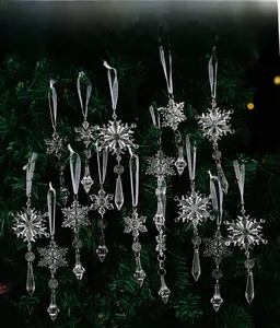 Detailed view of clear acrylic snowflake ornaments hanging on a festive Christmas tree