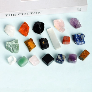 17-piece natural crystal stones set with raw minerals and tumbled gems on blue background