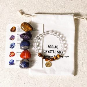 Natural zodiac crystal set with gemstone bracelet, raw stones, and a drawstring gift bag