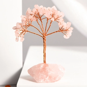 Handmade rose quartz crystal tree on natural raw stone base for home desk decoration