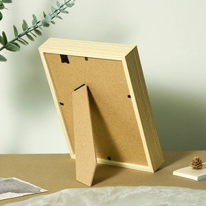 Back view of minimalist wooden picture frame with stand and metal clips for home decor