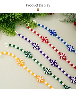 Close-up of peppermint candy beads and tassel garlands for Christmas decorations