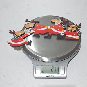 Close-up showing the 21.4g weight of wooden Christmas reindeer door frame ornaments