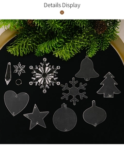 Detailed display of 11 assorted clear acrylic Christmas ornaments with pine cone accents