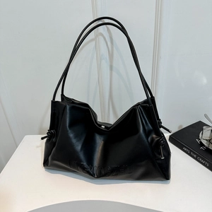 Large soft leather black shoulder bag with minimalist silhouette and dual straps