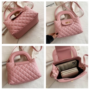 Detail of pink quilted handbag showing interior capacity for phone and wallet with metal clasp