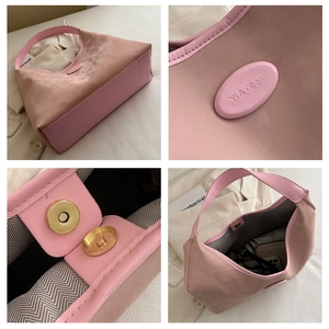 Detail der rosa Umhängetasche mit Magnetverschluss und Futter mit Fischgrätenmuster
