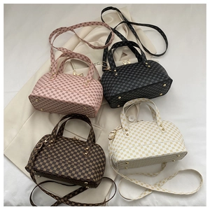 Flat lay of four vintage-print shell bags in pink, black, brown, and floral patterns