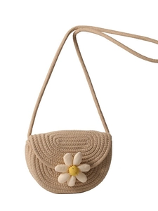 Handmade woven straw saddle bag with white daisy detail and long rope shoulder strap