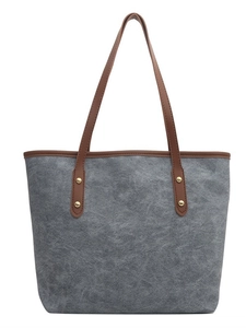 Grand sac cabas en toile grise avec anses en cuir marron et rivets dorés élégants