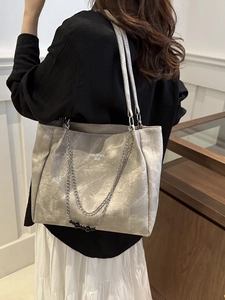 Large capacity grey faux leather tote bag with chain detail shown from a back perspective