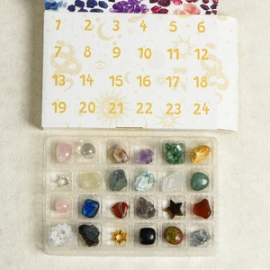 24-piece natural crystal advent calendar set with polished stones and occult symbols