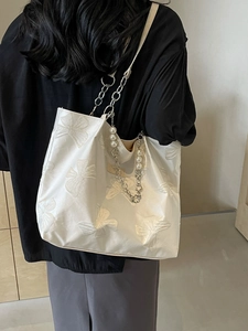 Fashionable cream satin tote bag with 3D bow jacquard and pearl chain strap