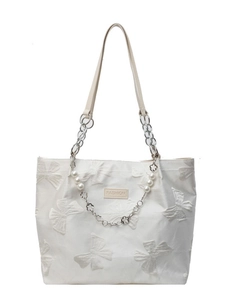 White tote bag with 3D butterfly embroidery, pearl chain, and Fashion label detail