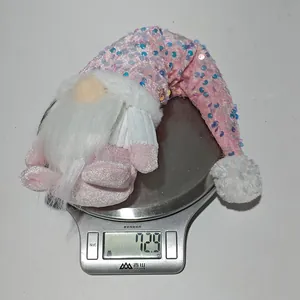 Pink sequin Christmas gnome decoration shown on a scale weighing 72.9 grams