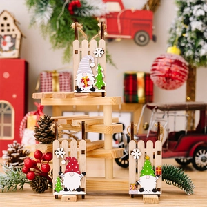 Detailed view of three handcrafted wooden gnome sled ornaments with rustic jute ropes