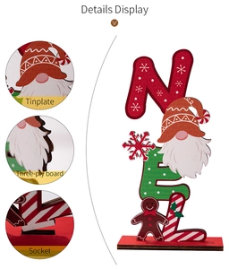 Macro detail of Christmas Noel letter tabletop decor showing wood and tinplate texture