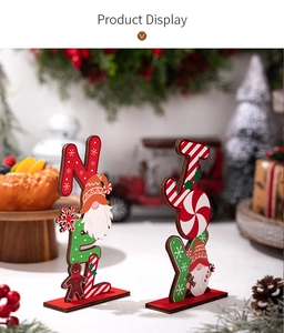 Detailed view of NOEL and JOY Christmas wooden signs with gingerbread man and gnome