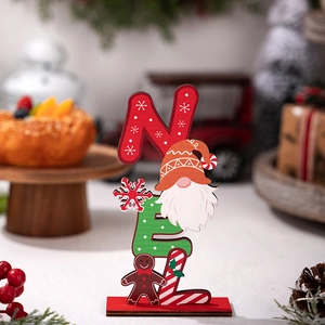 Close-up of wooden Noel Christmas decoration featuring gingerbread man and gnome details