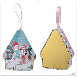 Detailed view of house-shaped Christmas tin box with festive snowman penguin illustration