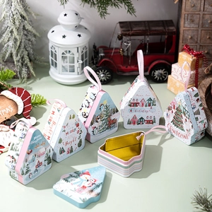 Christmas tin gift boxes in house and tree shapes with festive illustrations and silk ribbons